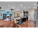 Spacious kitchen island with marble countertops, stainless steel appliances, and an open floor plan at 988 145Th Street Ne Cir, Bradenton, FL 34212