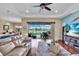 Cozy living room with hardwood floors and a view of the backyard patio through sliding glass doors at 988 145Th Street Ne Cir, Bradenton, FL 34212