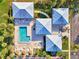 Overhead view of community pool, spa, and clubhouse buildings with well-maintained landscaping at 3008 Sail Pointe Cir # 2C, Venice, FL 34293