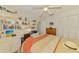 Bedroom with built-in shelves, a desk area, and a comfortable bed at 3008 Sail Pointe Cir # 2C, Venice, FL 34293