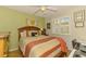 Cozy bedroom with a comfy bed, natural light, and a ceiling fan at 3008 Sail Pointe Cir # 2C, Venice, FL 34293