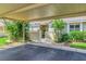 Charming home with covered parking and inviting front entrance, surrounded by lush greenery at 3008 Sail Pointe Cir # 2C, Venice, FL 34293