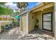 Inviting front porch with a charming outdoor seating area and lush greenery enhancing the home's curb appeal at 3008 Sail Pointe Cir # 2C, Venice, FL 34293