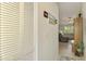 Bright hallway featuring closet and inviting view into the spacious living room at 3008 Sail Pointe Cir # 2C, Venice, FL 34293