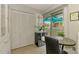 Bright kitchen nook area with tile floor and sliding glass door to a patio at 3008 Sail Pointe Cir # 2C, Venice, FL 34293