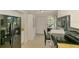 Cozy kitchen space with stainless steel fridge, storage and breakfast nook at 3008 Sail Pointe Cir # 2C, Venice, FL 34293
