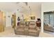 Relaxing living room featuring a modern ceiling fan, comfortable seating and a tranquil view outdoors at 3008 Sail Pointe Cir # 2C, Venice, FL 34293