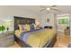 Spacious main bedroom with stylish decor, ensuite bath and ample natural light at 3008 Sail Pointe Cir # 2C, Venice, FL 34293