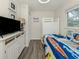 Bright bedroom with bunk beds, grey wood floors and nautical decor at 1001 Inlet Cir # 269, Venice, FL 34285