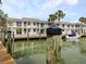 Condo building with private boat docks, offering scenic views and boating opportunities at 1001 Inlet Cir # 269, Venice, FL 34285