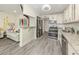 Modern kitchen features stainless steel appliances, granite countertops and connects to an inviting living room area at 1001 Inlet Cir # 269, Venice, FL 34285