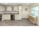 Bright kitchen features granite counters, stainless appliances and white cabinetry, plus a waterside breakfast area at 1001 Inlet Cir # 269, Venice, FL 34285