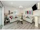 Bright living room with tile floors, coastal decor, sliding glass doors, and accent tables at 1001 Inlet Cir # 269, Venice, FL 34285