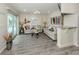 Bright living room with tile floors, coastal decor, sliding glass doors, and a granite countertop bar area at 1001 Inlet Cir # 269, Venice, FL 34285