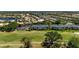 A beautiful aerial view of condos overlooking a manicured golf course in a gated community at 1007 Gondola Park Dr # 1007, Venice, FL 34292