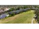 Scenic aerial view of condos on a golf course with lush green landscaping at 1007 Gondola Park Dr # 1007, Venice, FL 34292