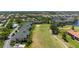 Aerial view of condos on a golf course with a scenic pond in the community at 1007 Gondola Park Dr # 1007, Venice, FL 34292