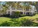 Beautiful backyard view of the townhome featuring balconies, landscaping and mature trees at 1007 Gondola Park Dr # 1007, Venice, FL 34292