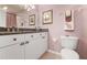Bathroom with granite countertop vanity, white cabinets, decorative towels and wall decor at 1007 Gondola Park Dr # 1007, Venice, FL 34292