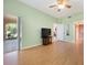 Bedroom with ceiling fan, hardwood flooring, neutral paint, large window, and patio access at 1007 Gondola Park Dr # 1007, Venice, FL 34292