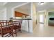 Cozy dining area features seating for four and an open view into the kitchen at 1007 Gondola Park Dr # 1007, Venice, FL 34292