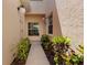 Inviting entrance showcasing lush landscaping and a well-maintained walkway, ensuring a warm welcome at 1007 Gondola Park Dr # 1007, Venice, FL 34292