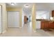 Bright hallway featuring tile floors and ample closet space, offering both style and functionality at 1007 Gondola Park Dr # 1007, Venice, FL 34292