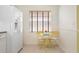 Bright kitchen featuring a breakfast nook with a table and chairs near a window at 1007 Gondola Park Dr # 1007, Venice, FL 34292