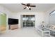 Cozy living room with sliding glass doors offering backyard views and plenty of natural light at 1007 Gondola Park Dr # 1007, Venice, FL 34292