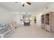 Spacious living area featuring tile flooring, modern furnishings, and a seamless transition to dining area at 1007 Gondola Park Dr # 1007, Venice, FL 34292