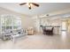Inviting living room with neutral tones, open to the dining area, with a large window at 1007 Gondola Park Dr # 1007, Venice, FL 34292