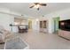 This open concept living room features tile flooring and an adjacent dining space at 1007 Gondola Park Dr # 1007, Venice, FL 34292