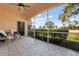 Screened patio featuring tiled floor, ceiling fan and outside view at 1007 Gondola Park Dr # 1007, Venice, FL 34292