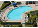 Large community pool surrounded by lounging chairs and a well manicured brick patio at 1007 Gondola Park Dr # 1007, Venice, FL 34292
