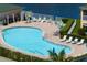 Beautiful community pool with plenty of seating, surrounded by lush landscaping at 1007 Gondola Park Dr # 1007, Venice, FL 34292