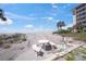 Beautiful beach view with a picnic table and water spout perfect for rinsing off after a day in the sand at 1100 Tarpon Center Dr # 104, Venice, FL 34285