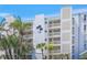 Bahia Mar condominium building with multiple balconies and lush landscaping at 1100 Tarpon Center Dr # 104, Venice, FL 34285