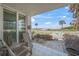 Relaxing patio with seating and views of the ocean at 1100 Tarpon Center Dr # 104, Venice, FL 34285