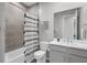 Well-lit bathroom showcasing a shower-tub combo with decorative curtain and a white vanity with great lighting at 11239 Boundless Ter, Venice, FL 34293