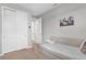 Cozy bedroom showcasing a daybed, closet with sliding doors, and neutral decor at 11239 Boundless Ter, Venice, FL 34293