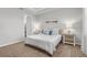 Cozy bedroom with carpet flooring, neutral wall color, and serene decor for a restful retreat at 11239 Boundless Ter, Venice, FL 34293