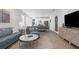 A view of the open concept living room, dining room, and kitchen areas at 11239 Boundless Ter, Venice, FL 34293
