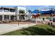 Chic restaurant featuring covered outdoor seating, modern architectural details, and ample dining space at 11239 Boundless Ter, Venice, FL 34293