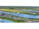 Scenic water feature with palm trees leading to the Brightmore entrance; a beautiful and inviting community landmark at 11239 Boundless Ter, Venice, FL 34293