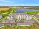 Luxury condo complex featuring covered parking, a pristine lake, and a beautiful golf course at 12140 Wellen Golf St # 401, Venice, FL 34293