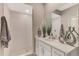 Modern bathroom showcasing a walk-in shower and elegant vanity at 12140 Wellen Golf St # 401, Venice, FL 34293