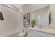 Bright bathroom featuring a shower with white subway tile and a modern vanity at 12140 Wellen Golf St # 401, Venice, FL 34293