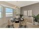 Chic dining room with a modern light fixture and stylish sideboard at 12140 Wellen Golf St # 401, Venice, FL 34293