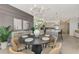 Open-concept dining area adjacent to a modern kitchen with stainless steel appliances at 12140 Wellen Golf St # 401, Venice, FL 34293