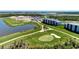 Scenic golf course view within the new community, surrounded by lush landscaping at 12140 Wellen Golf St # 401, Venice, FL 34293